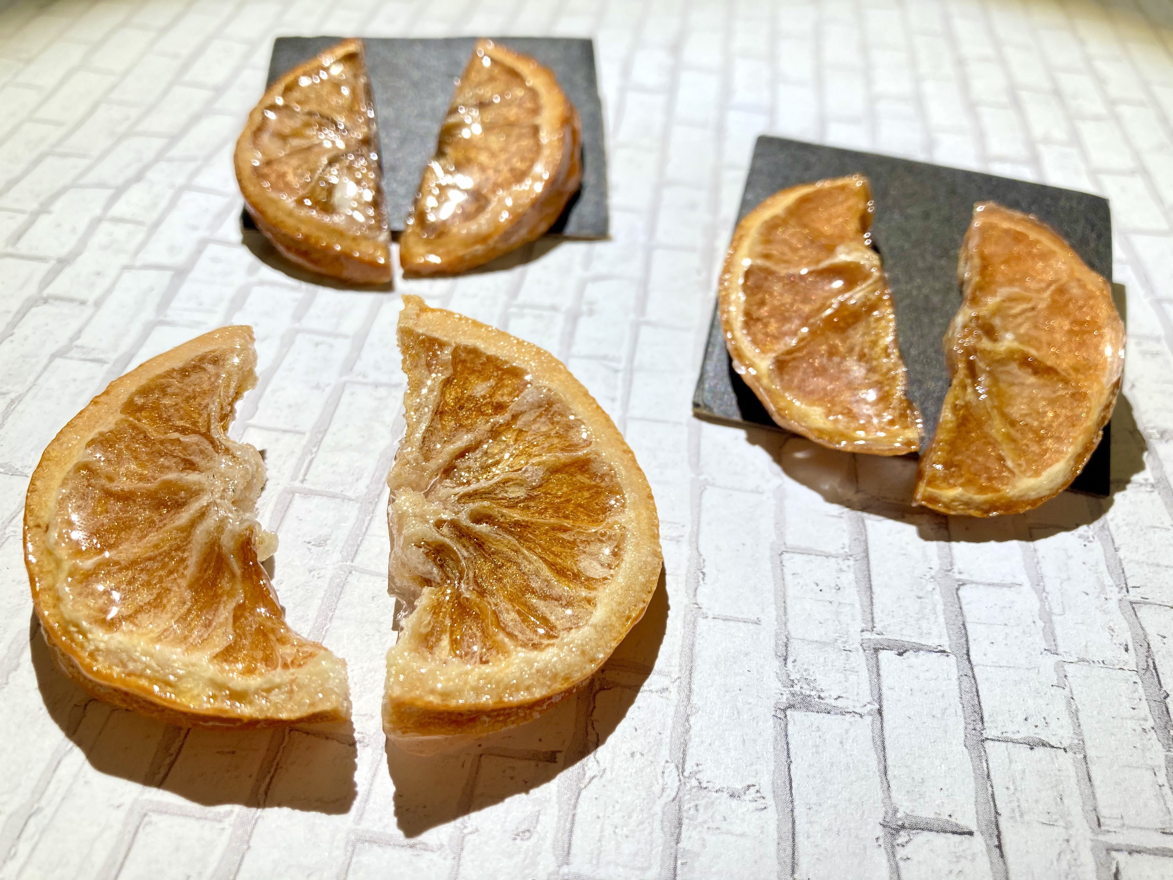 Low snacks: Half Oranges | Real Orange slices with resin coating and gold pegs. 
    These oranges will never go bad! Nickel free brass.